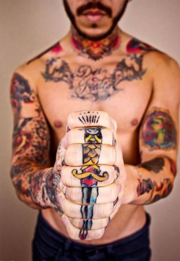 large dagger finger tattoos for men
