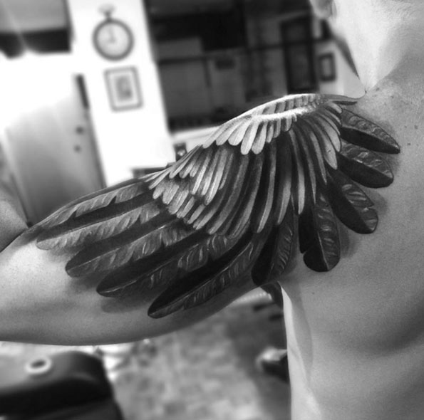 metal and feathers wing tattoo for men