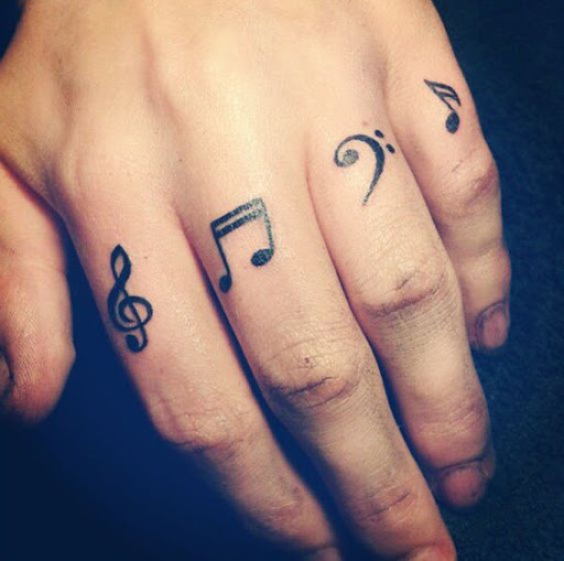 musical notes finger tattoos for men