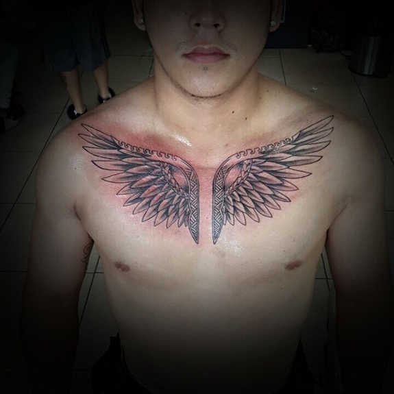 neat wing tattoo for men
