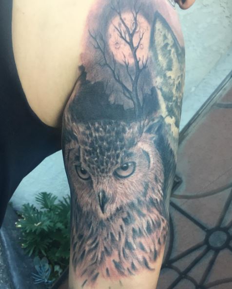 owl against moonlight men's halfsleeve tattoo