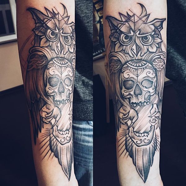owl and stylized skull men's arm tattoo