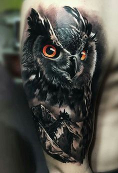 owl over mountainscape men's arm tattoo