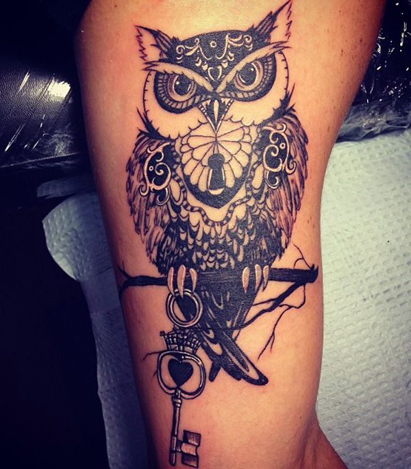 owl with key and lock men's inner arm tattoo