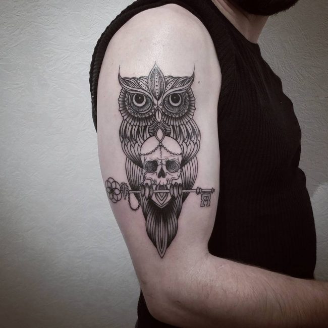 owl with skull and key men's arm tatoo