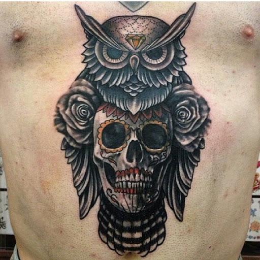 owl with skull men's torso tattoo