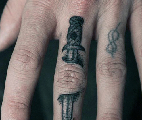 piercing sword finger tattoo for men