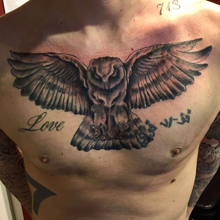 realistic owl men's chest tattoo