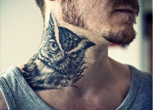 realistic owl tattoo on man's neck