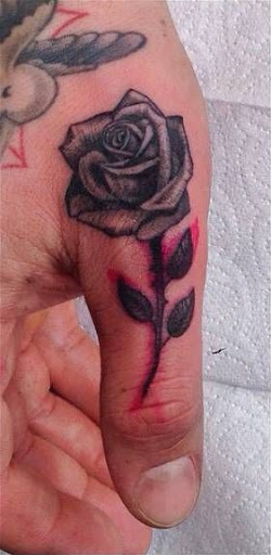 rose finger tattoo for men