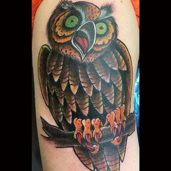 screeching owl men's arm tattoo