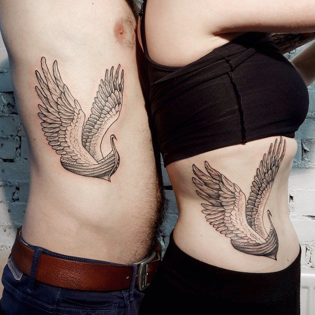 ship and wing rib tattoo for men