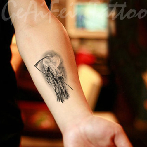 small grim reaper tattoo for men wrist