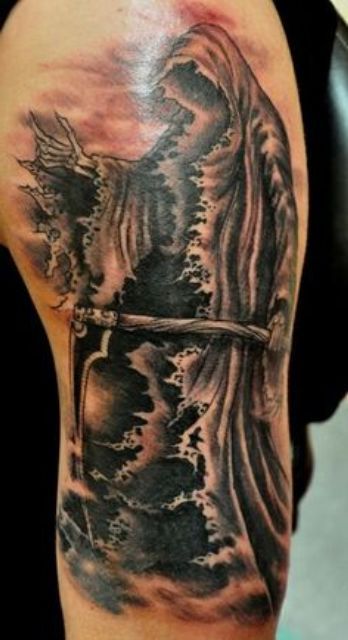 sunset and grim reaper tattoo for men