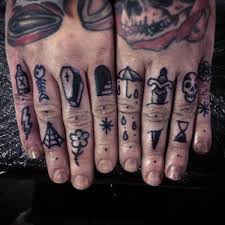 variety of small finger tattoos for men