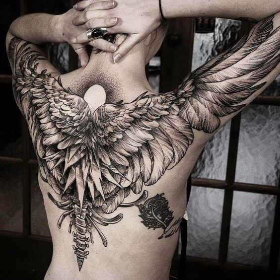 wing and spine tattoo for men