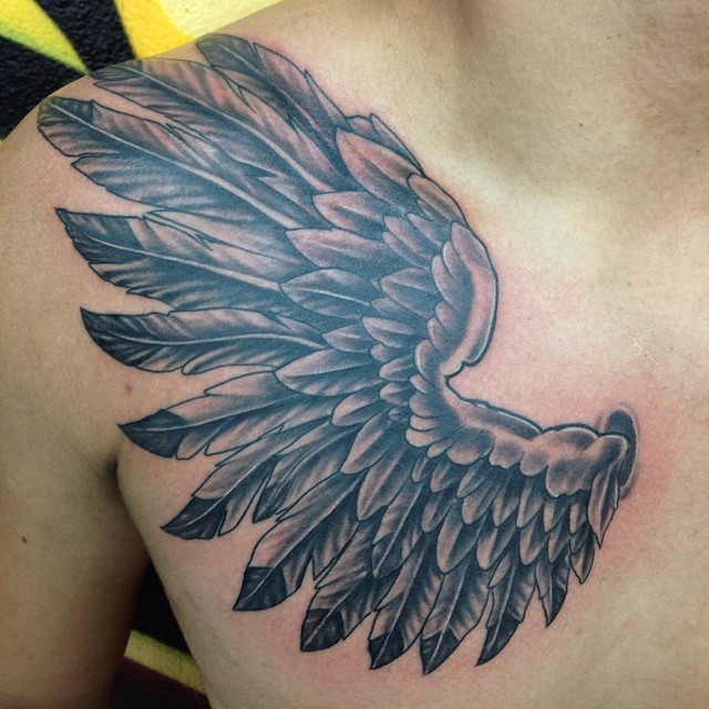 wing tattoo for men's chests and shoulders