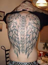 wings and vertebrae tattoo for men