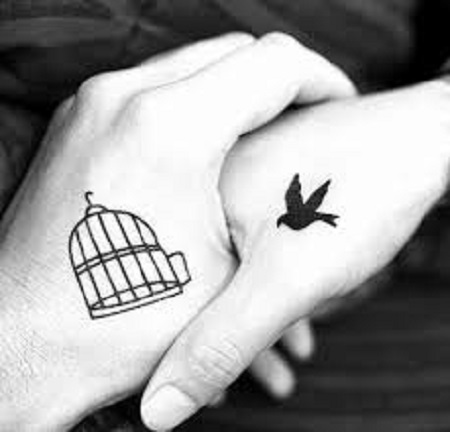 bird and cage matching couple tattoo