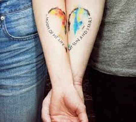 colored heart matching couple tattoo