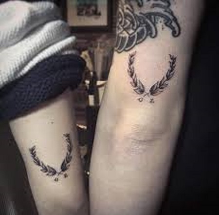 feathers matching couple tattoo