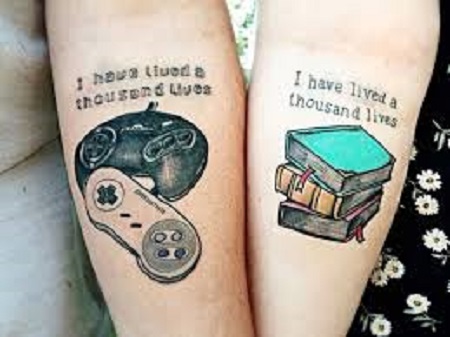 games and books matching couple tattoo