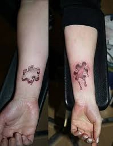 puzzle pieces matching couple tattoo