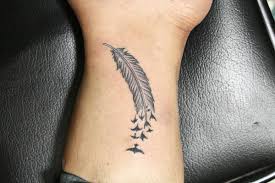 small feather tattoo for men
