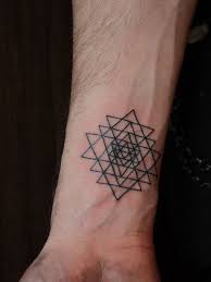 small geometric design tattoo for men