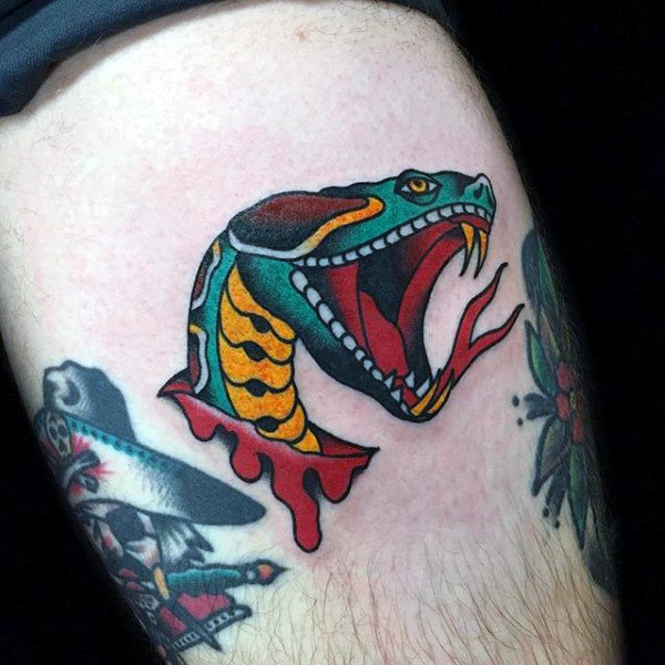 Vibrant Upper Thigh Serpent Tattoo