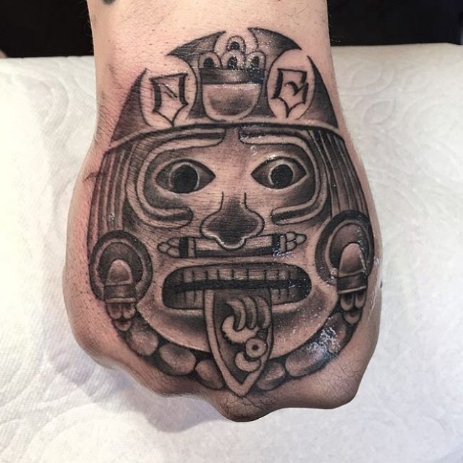 Aztec Death Mask Hand Tattoo