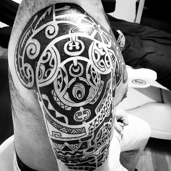 Aztec Tattoo Involving Hooks, Ramshorns, and Scorpions