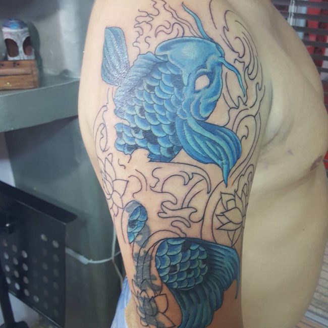 Blue Koi Fish in Negative Space Waves