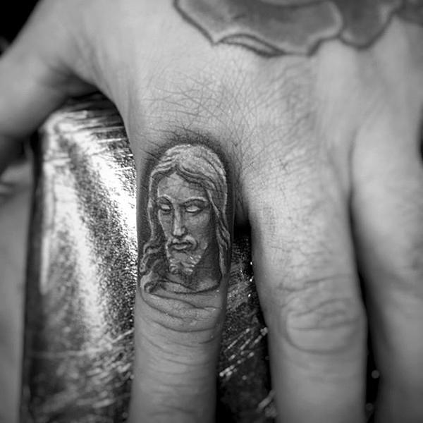 Finger Tattoo of a Portrait of Jesus