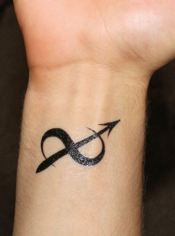 Infinity Sign Tattoo Made with an Arrow for Perseverance