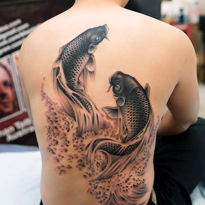 Lifelike Koi Fish Back Tattoo