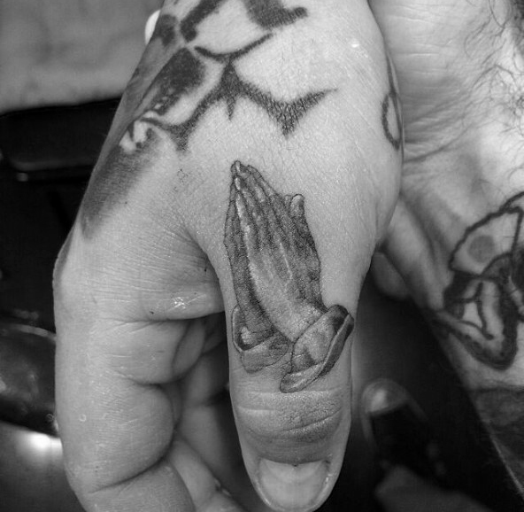 Prayer Hands as a Small Thumb Tattoo