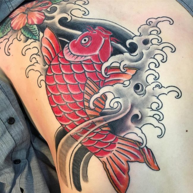 Red Koi Fish Swimming in Black Waves Tattoo