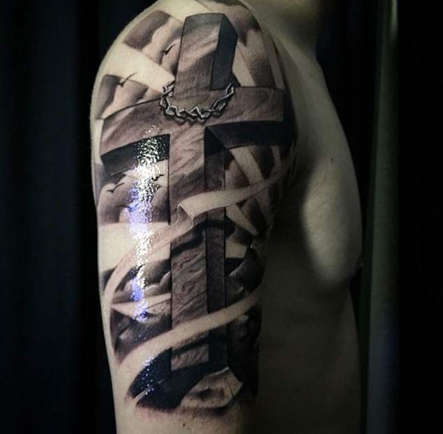 Use of Negative Space in Crucifix Arm Tattoo