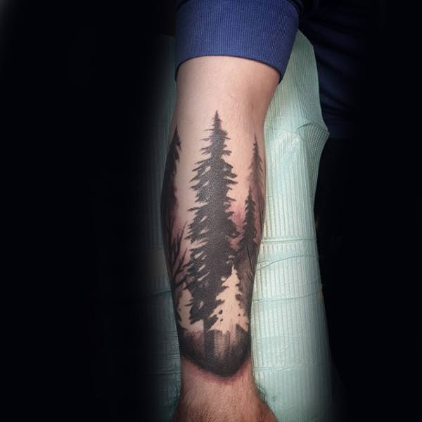 Black Ink and Negative Space Trees Forearm Tattoo