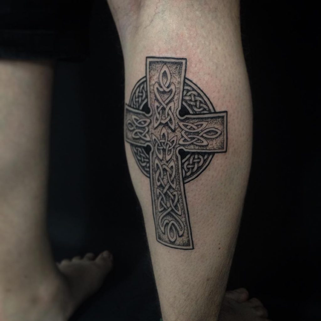 Calf Tattoo of a Stained Glass Window Cross