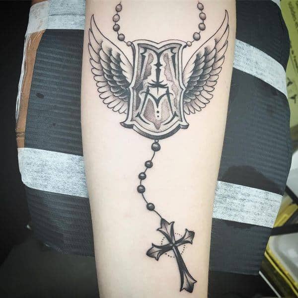 Grey Rosary Medallion Forearm Tattoo