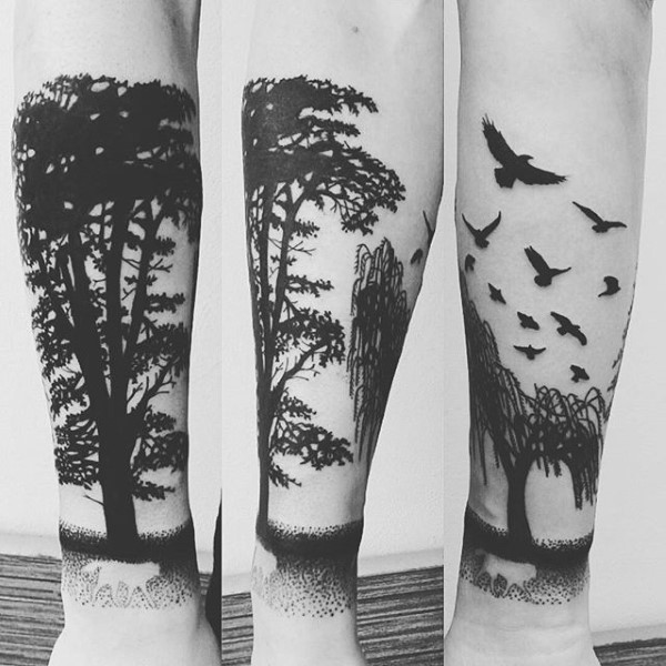 Negative Space Flying Birds and Forest Trees Forearm Tattoo