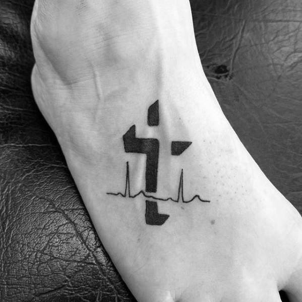 Negative Space Shadowed Cross Foot Tattoo Idea with a Heartbeat