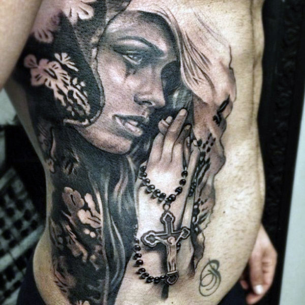 Rib Cage Portrait Tattoo of a Woman Holding a Rosary
