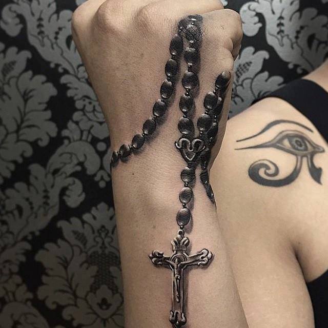 Rosary Tattoo that Looks Like You are Holding Onto the Beads