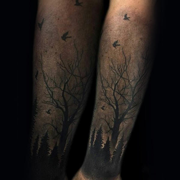 Shaded Forearm Tattoo of a Forest at Dusk