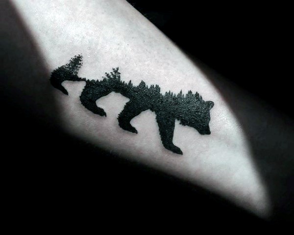 Slanted Forearm Tattoo of a Bear with Forest Trees on Back