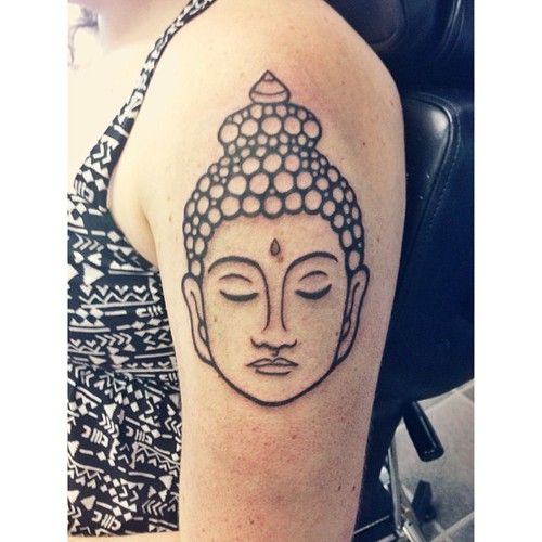 Upper Arm Tattoo Outlining the Buddha