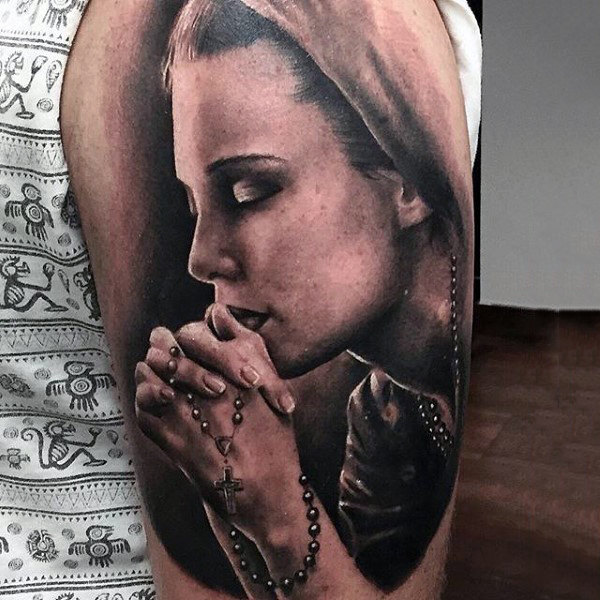 Upper Arm Tattoo of a Woman with Rosary Beads